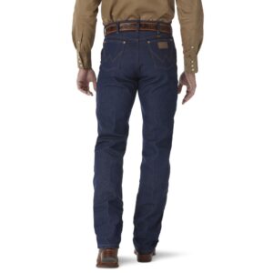 A modeled, rear-facing look at a pair of Wrangler Rigid Cowboy Cut Original Fit Jeans.