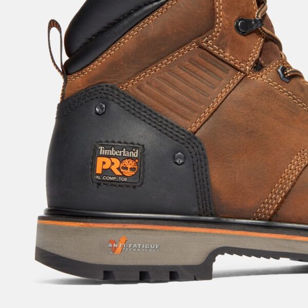 Close up of Timberland Ballast safety toe men's 6-inch work boot in brown showing composite toe tag with a blank background.