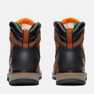 A look at the heels of a pair of Timberland Ballast composite toe men's 6-inch work boots in brown with a blank background.