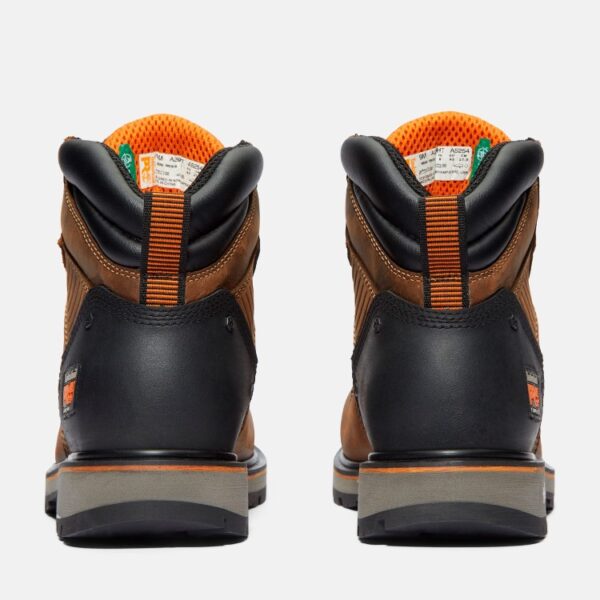 A look at the heels of a pair of Timberland Ballast composite toe men's 6-inch work boots in brown with a blank background.
