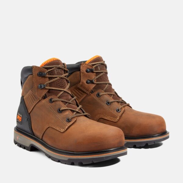 A turned pair of Timberland Ballast composite toe men's 6-inch work boots in brown with a blank background.