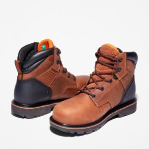 An offset pair of Timberland Ballast steel toe 6-inch men's work boots in brown with a blank background.