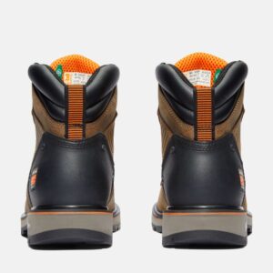 A look at the heels of a pair of Timberland Ballast soft toe men's 6-inch work boots in tan with a blank background.