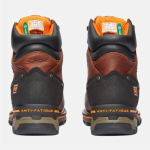 A look at the heels of a pair of Timberland Boondock composite toe 6-inch waterproof insulated men's work boots in brown with a blank background.