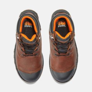 Overhead shot of a pair of Timberland Boondock composite toe 6-inch waterproof insulated men's work boots in brown with a blank background.