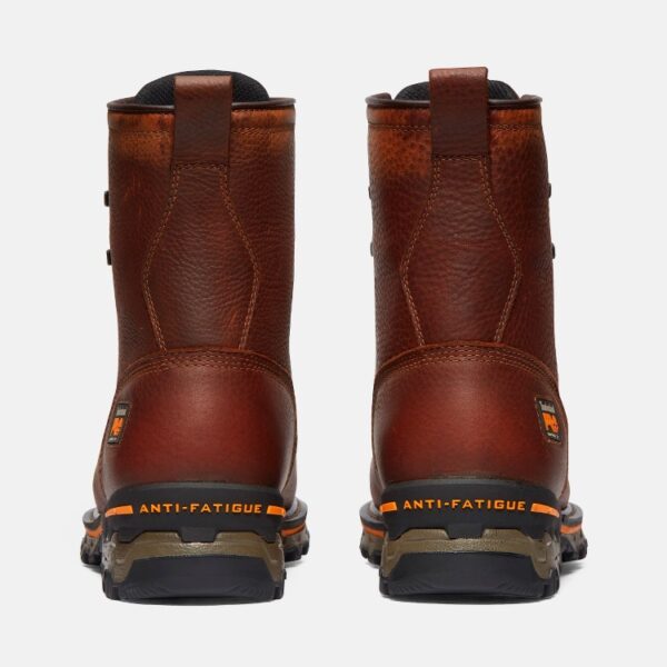 A look at the heels of a pair of Timberland Boondock composite toe waterproof 8-inch men's work boots in brown with a blank background.