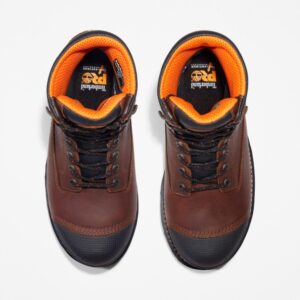Overhead shot of a pair of Timberland Boondock composite toe 8-inch waterproof men's work boots in brown with a blank background.