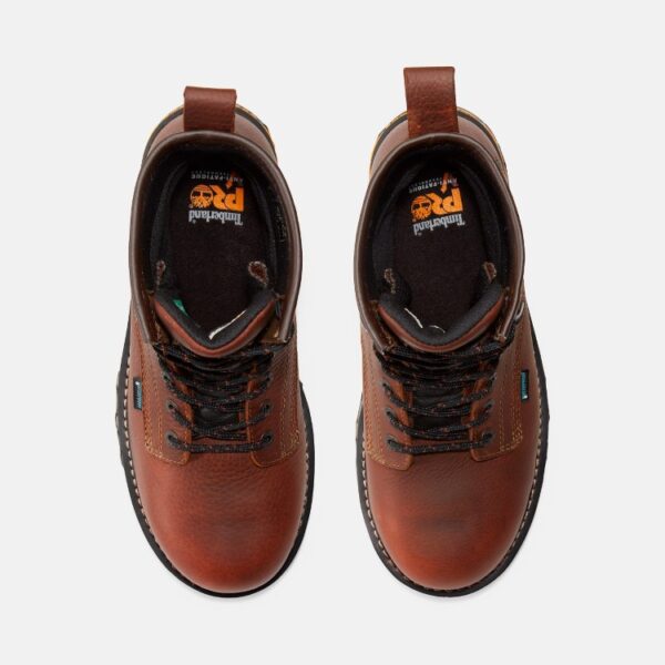 Overhead shot of a pair of Timberland Boondock waterproof composite toe 8-inch men's work boots in brown with a blank background.