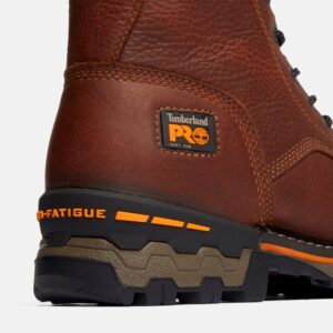 Close up of Timberland Boondock Soft Toe 8-inch men's work boot in brown showing anti-fatigue technology marking with a blank background.