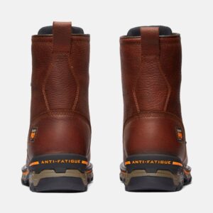 A look at the heels of a pair of Timberland Boondock soft toe waterproof 8-inch men's work boots in brown with a blank background.