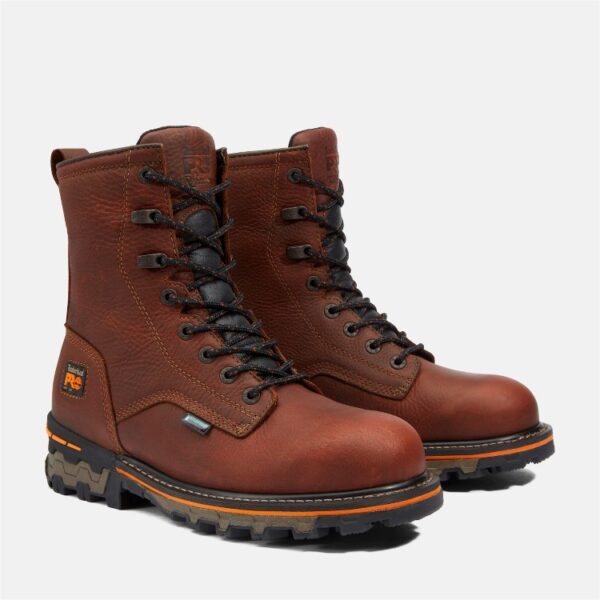 A turned pair of Timberland Boondock soft toe 8-inch waterproof men's work boots in brown with a blank background.