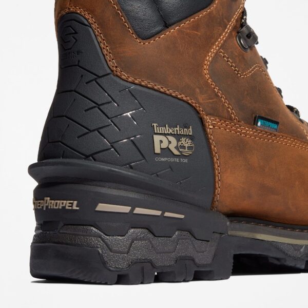 Close up of Timberland Boondock HD safety toe men's 6-inch waterproof insulated work boot in brown showing composite toe stamp with a blank background.
