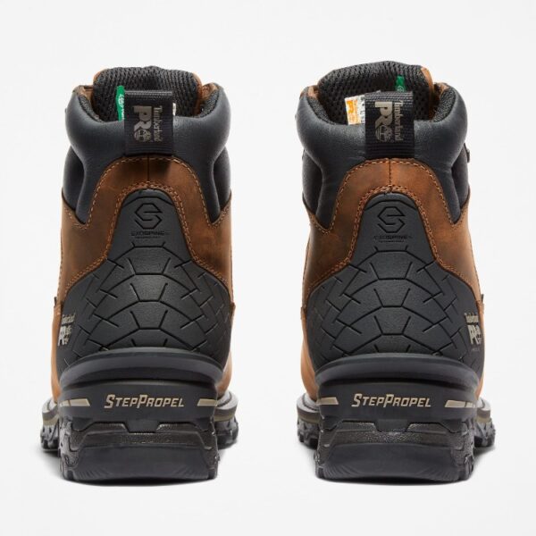 A look at the heels of a pair of Timberland Boondock HD composite toe waterproof insulated men's 6-inch work boots in brown with a blank background.