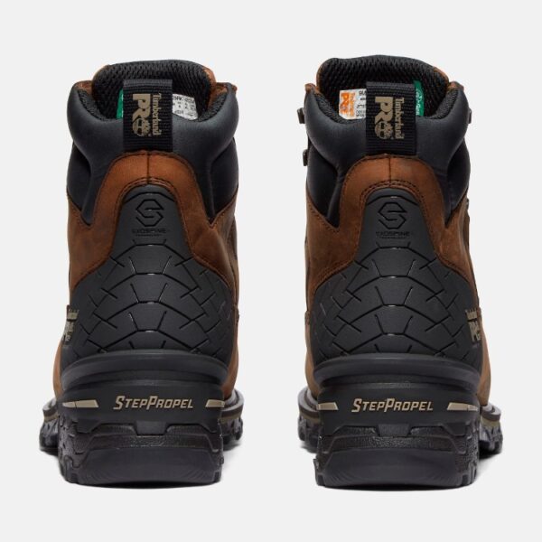 A look at the heels of a pair of Timberland Boondock HD composite toe waterproof men's 6-inch work boots in brown with a blank background.