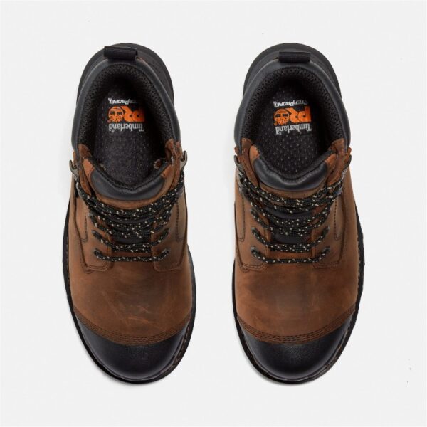 Overhead shot of a pair of Timberland Boondock HD composite toe waterproof men's 6-inch work boots in brown with a blank background.