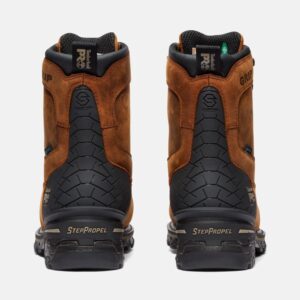 A look at the heels of a pair of Timberland Boondock composite toe waterproof men's 8-inch work boots in brown with a blank background.