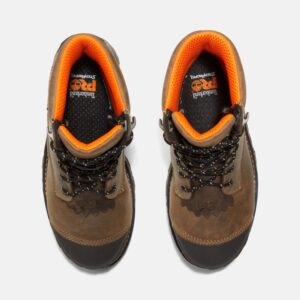 Overhead look at a pair of Timberland Boondock HD composite toe logger men's work boots in brown on a blank background.