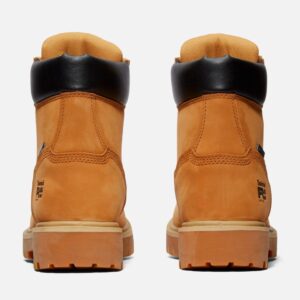 A look at the heels of a pair of Timberland Direct Attach soft toe waterproof 6-inch men's work boots in wheat color with a blank background.