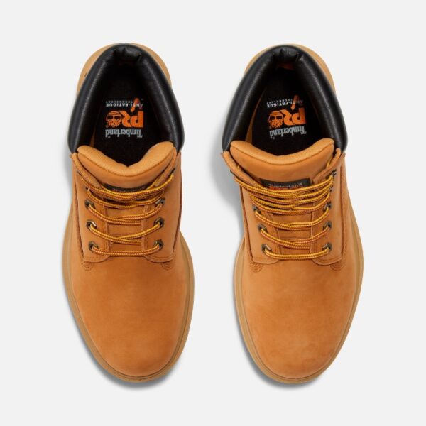Overhead shot of a pair of Timberland Direct Attach waterproof soft toe 6-inch men's work boots in wheat color with a blank background.