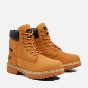 A turned pair of Timberland Direct Attach soft toe 6-inch waterproof men's work boots in wheat color with a blank background.