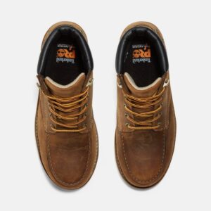 Overhead shot of a pair of Timberland Gridworks alloy toe waterproof men's 6-inch work boots in light brown with a blank background.