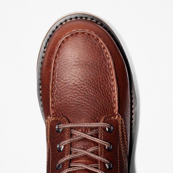 The right toe of a Timberland Gridworks alloy toe waterproof 6-inch work boot in brown on a blank background.
