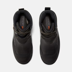 Overhead shot of a pair of Timberland Met Guard waterproof steel toe 8-inch men's work boots in black with a blank background.