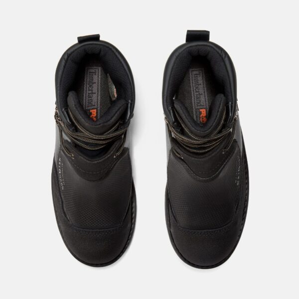 Overhead shot of a pair of Timberland Met Guard waterproof steel toe 8-inch men's work boots in black with a blank background.