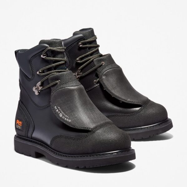 A turned pair of Timberland Met Guard steel toe 8-inch waterproof men's work boots in black with a blank background.