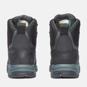 A look at the heels of a pair of Timberland Payload composite toe men's 6-inch work boots in black and gray with a blank background.