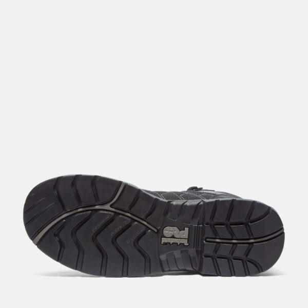 The sole of the right boot on a Timberland Payload composite toe men's 6-inch work boots in black and gray with a blank background.
