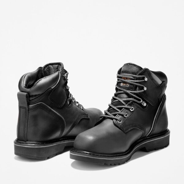 Offset pair of Timberland Pit Boss steel toe 6-inch men's work boots in black with a blank background.