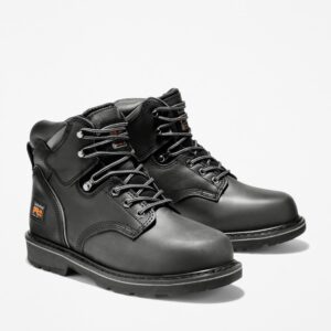 A turned pair of Timberland Pit Boss steel toe 6-inch men's work boots in black with a blank background.