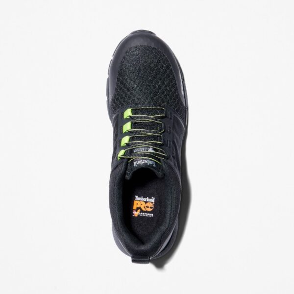 Overhead shot of the right shoe of a Timberland Radius composite toe low top men's work sneakers in black and green with a blank background.