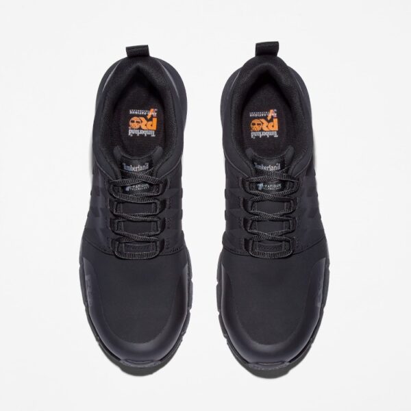 Overhead shot of a pair of Timberland Radius composite toe men's low top work sneakers in black with a blank background.