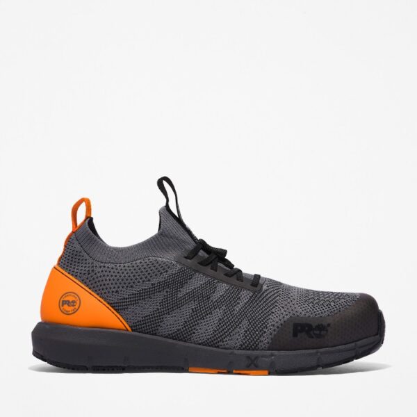 Right profile facing Timberland Radius composite toe men's work sneakers in gray and orange with a blank background.