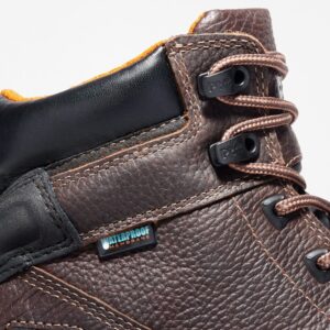 Close up of Timberland Rigmaster steel toe 6-inch men's work boot in brown showing waterproof tag with a blank background.
