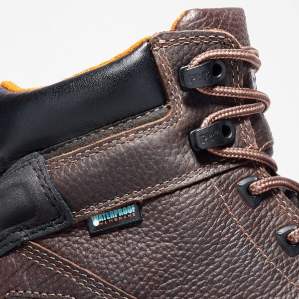 Close up of Timberland Rigmaster steel toe 6-inch men's work boot in brown showing waterproof tag with a blank background.