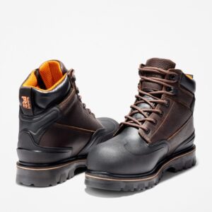 Offset pair of Timberland Rigmaster steel toe 6-inch waterproof men's work boots in brown with a blank background.