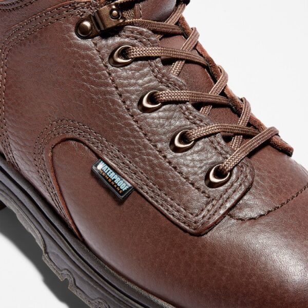 Close up of Timberland TiTAN Alloy Toe 6" Men's Work Boot showing waterproof tag with a blank background.