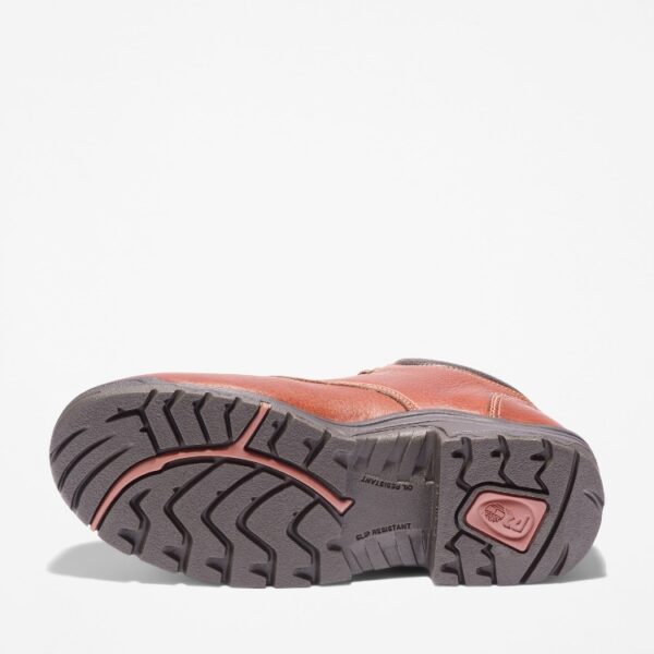 The sole of the right boot on a Timberland TiTAN casual alloy toe men's work shoe in brown with a blank background.