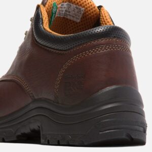Close up of Timberland TiTAN casual non-safety toe men's work shoe in brown showing soft toe imprint with a blank background.