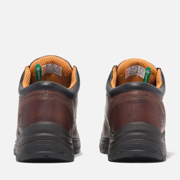 A look at the heels of a pair of Timberland TiTAN casual soft toe men's work shoes in brown with a blank background.