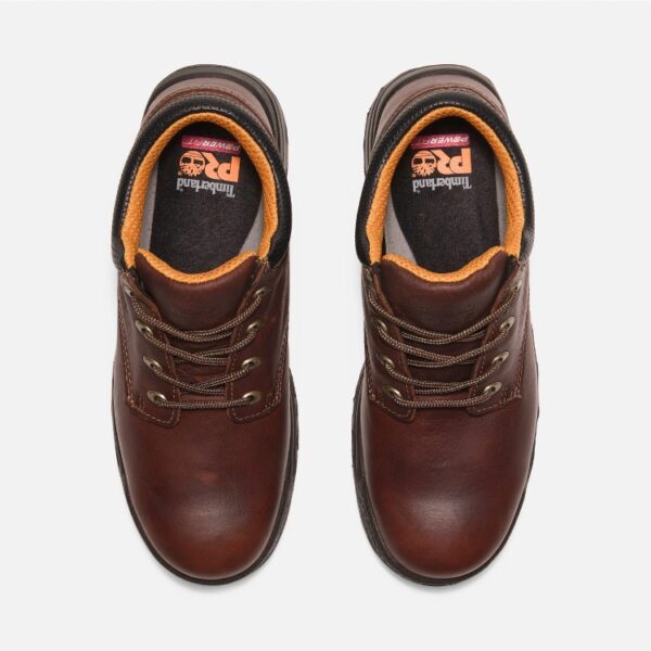 Overhead shot of a pair of Timberland TiTAN casual soft toe men's work shoes in brown with a blank background.