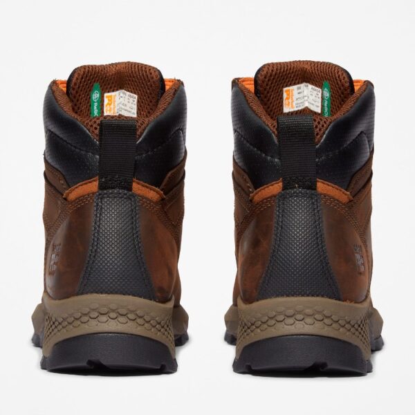 A look at the heels of a pair of Timberland TiTAN EV composite toe men's 6-inch work boots in brown with a blank background.