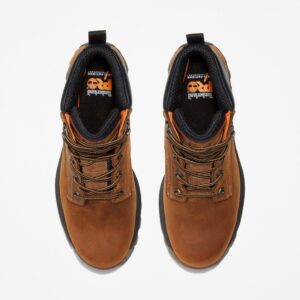 Overhead look at a pair of Timberland TiTAN EV soft toe waterproof men's 6-inch work boots in light brown on a blank background.