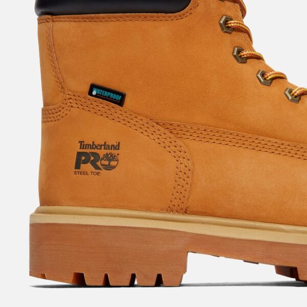 Close up of Timberland PRO Direct Attach waterproof insulated steel toe 6-inch men's work boot in wheat showing waterproof tag with a blank background.