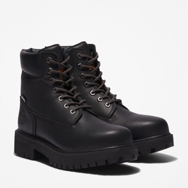 A turned pair of Timberland PRO Direct Attach Soft Toe 6" Waterproof Insulated work boots in black.