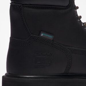 Close up of Timberland PRO Direct Attach Soft Toe Men's Work Boot in black showing waterproof tag with a blank background.