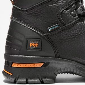 Close up of Timberland PRO Endurance waterproof 6-inch men's work boot in black showing steel toe tag with a blank background.
